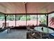 Screened patio with tile flooring and outdoor seating, perfect for enjoying the backyard view at 2033 Shadow Pine Dr, Brandon, FL 33511