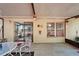 Covered patio features tile flooring and access to home, seamlessly connecting indoor and outdoor spaces at 2033 Shadow Pine Dr, Brandon, FL 33511