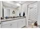 Elegant bathroom featuring a double vanity with granite countertop and stylish fixtures at 21832 Crest Meadow Dr, Land O Lakes, FL 34637
