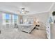 Bright bedroom with ceiling fan, natural light, and matching furniture set at 21832 Crest Meadow Dr, Land O Lakes, FL 34637