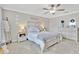 Bedroom features a ceiling fan, sign, crown molding, and matching furniture set at 21832 Crest Meadow Dr, Land O Lakes, FL 34637