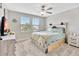 Bedroom with ceiling fan and two windows providing natural light at 21832 Crest Meadow Dr, Land O Lakes, FL 34637