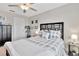 Bedroom with black grid headboard, ceiling fan, and black dresser at 21832 Crest Meadow Dr, Land O Lakes, FL 34637