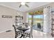 Dining area featuring a sliding glass door providing view of the outdoor area and filling the space with natural light at 21832 Crest Meadow Dr, Land O Lakes, FL 34637