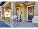 Inviting front porch showcasing decorative hanging plants and a stylish, welcoming entrance at 21832 Crest Meadow Dr, Land O Lakes, FL 34637