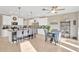 Open concept kitchen with island and adjacent dining area with stylish accents and natural light at 21832 Crest Meadow Dr, Land O Lakes, FL 34637