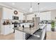 Bright kitchen boasts white cabinets, granite countertops, stainless steel appliances, and a large central island at 21832 Crest Meadow Dr, Land O Lakes, FL 34637