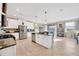 Open kitchen with stainless steel appliances and island seating, and sliding doors to backyard at 21832 Crest Meadow Dr, Land O Lakes, FL 34637