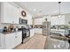 Well-lit kitchen with white cabinets, stainless steel appliances, and granite countertops at 21832 Crest Meadow Dr, Land O Lakes, FL 34637