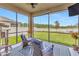 Screened lanai featuring comfortable seating, a ceiling fan, and a view of the lush backyard at 21832 Crest Meadow Dr, Land O Lakes, FL 34637