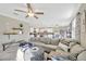Open concept living room and kitchen area with modern decor and plenty of natural light at 21832 Crest Meadow Dr, Land O Lakes, FL 34637