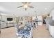 Open-concept living room featuring a kitchen with modern appliances and a cozy seating area at 21832 Crest Meadow Dr, Land O Lakes, FL 34637