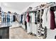 Well-organized walk-in closet featuring shelving, hanging rods, and shoe storage for ample space at 21832 Crest Meadow Dr, Land O Lakes, FL 34637