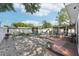 Backyard featuring wood decks, a screened porch, and low-maintenance gravel landscaping at 2362 Mary Ln, Clearwater, FL 33763