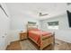 Charming bedroom featuring hardwood floors, a ceiling fan, and well-lit windows at 2362 Mary Ln, Clearwater, FL 33763