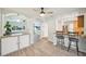 Open-concept dining area with breakfast bar overlooking the living room and kitchen at 2362 Mary Ln, Clearwater, FL 33763