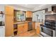 Bright kitchen features stainless steel appliances, granite countertops, and wood cabinets at 2362 Mary Ln, Clearwater, FL 33763