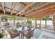 Inviting screened patio with a dining set, offering a comfortable outdoor space at 2362 Mary Ln, Clearwater, FL 33763