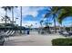 Spacious outdoor pool area, with lounge chairs, umbrellas, and ample seating at 2401 Richmond Greens Ct, Sun City Center, FL 33573