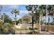 A beautiful Sun City Center entrance sign surrounded by trees and fountain at 2401 Richmond Greens Ct, Sun City Center, FL 33573