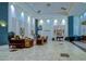 Lobby area with comfortable seating, stylish decor, recessed lighting, and a Veterans Theater entrance at 2401 Richmond Greens Ct, Sun City Center, FL 33573
