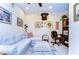 Comfortable office space with decorative sofa, large work chair, and curated wall art at 2401 Richmond Greens Ct, Sun City Center, FL 33573