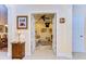 View of an office space featuring a comfortable couch, ceiling fan, and curated wall art at 2401 Richmond Greens Ct, Sun City Center, FL 33573