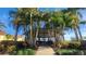 Outdoor gathering spot under a gazebo surrounded by palm trees at 2401 Richmond Greens Ct, Sun City Center, FL 33573