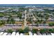 Aerial view of a neighborhood showcasing the property's location, with a red arrow indicating the home at 2930 S Pines Dr # 109, Largo, FL 33771