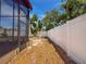 View of the backyard, fence, and foliage seen from patio at 2930 S Pines Dr # 109, Largo, FL 33771