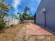 Backyard with tiled patio, perimeter fence, and exterior of the home at 2930 S Pines Dr # 109, Largo, FL 33771
