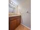 Bathroom featuring tiled floors, vanity with sink, and updated lighting at 2930 S Pines Dr # 109, Largo, FL 33771