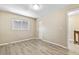 Bedroom with wood-look flooring, closet, and window providing natural light at 2930 S Pines Dr # 109, Largo, FL 33771