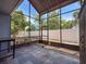 Enclosed lanai with tiled flooring, screen enclosure, and view of backyard and fence at 2930 S Pines Dr # 109, Largo, FL 33771