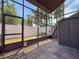 Enclosed lanai with tiled flooring, exterior access, and outdoor storage at 2930 S Pines Dr # 109, Largo, FL 33771