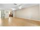 Open living space featuring tile flooring, a ceiling fan, and an open view into the kitchen area at 2930 S Pines Dr # 109, Largo, FL 33771