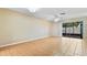 Spacious living room featuring tile floors and sliding glass doors that provide natural light and backyard access at 2930 S Pines Dr # 109, Largo, FL 33771