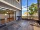 Enclosed patio with tiled flooring, exterior access, and sliding glass door entry into the home at 2930 S Pines Dr # 109, Largo, FL 33771