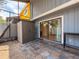 Rear patio with tiled flooring, outdoor storage, and sliding glass door entry into the home at 2930 S Pines Dr # 109, Largo, FL 33771