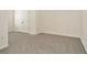 A bedroom with gray carpet flooring, white walls and double doors to a closet at 2949 Suncoast Plains Dr, Odessa, FL 33556