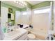 Bathroom with neutral colored walls and plenty of counter space and a shower with a curtain at 3051 Jodi Ln, Palm Harbor, FL 34684