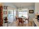 Bright breakfast nook featuring wood floors, pool view, and cozy seating for casual dining at 3051 Jodi Ln, Palm Harbor, FL 34684