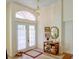 Inviting foyer with natural light, decorative lighting, and beautiful flooring, perfect for welcoming guests at 3051 Jodi Ln, Palm Harbor, FL 34684