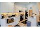 Bright kitchen with white cabinetry, sleek appliances, and modern countertops at 3051 Jodi Ln, Palm Harbor, FL 34684