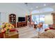 Comfortable living room showcasing stylish furniture, built-in bookshelves, and access to outdoor space at 3051 Jodi Ln, Palm Harbor, FL 34684