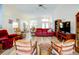 Bright and airy living room featuring comfortable seating, creating a relaxing and inviting atmosphere at 3051 Jodi Ln, Palm Harbor, FL 34684