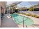 Enjoy this refreshing screened-in pool, perfect for relaxation and fun in the sun at 3051 Jodi Ln, Palm Harbor, FL 34684