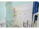 Bathroom shower featuring a grab bar, built in shelves, and a frosted glass door at 3051 Jodi Ln, Palm Harbor, FL 34684