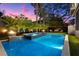 Backyard features a refreshing pool, spa, and fire pit, perfect for relaxing evenings and elegant entertaining at 3105 S Schiller St, Tampa, FL 33629