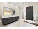 Elegant bathroom featuring a modern double vanity, soaking tub, and marble tile at 3105 S Schiller St, Tampa, FL 33629